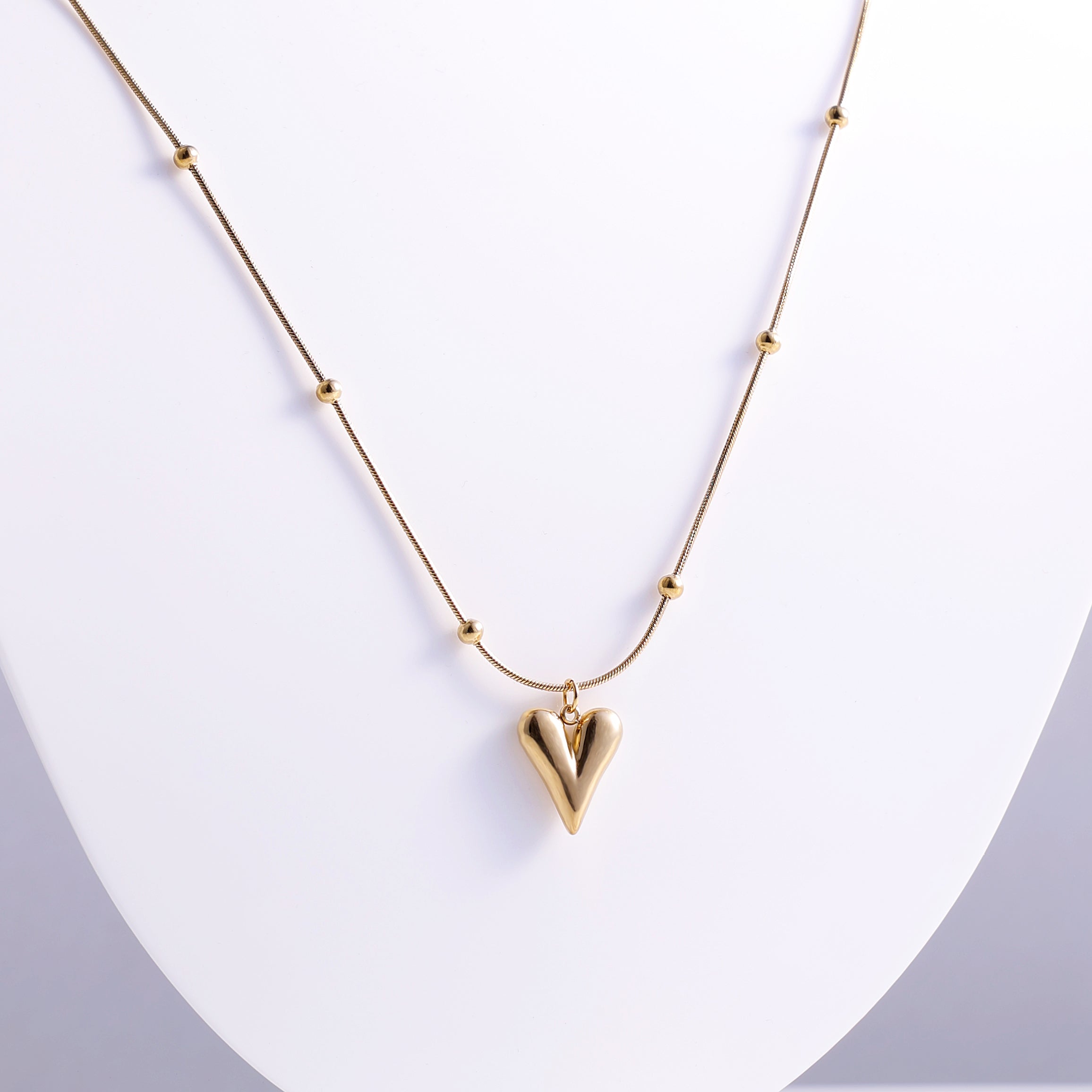 Stylish Gold Heart Necklace with Decorative Beaded