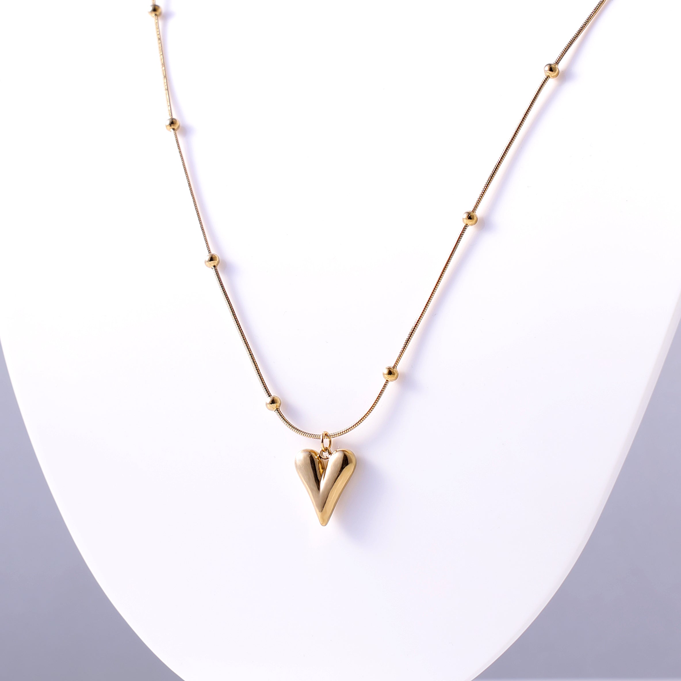 Stylish Gold Heart Necklace with Decorative Beaded