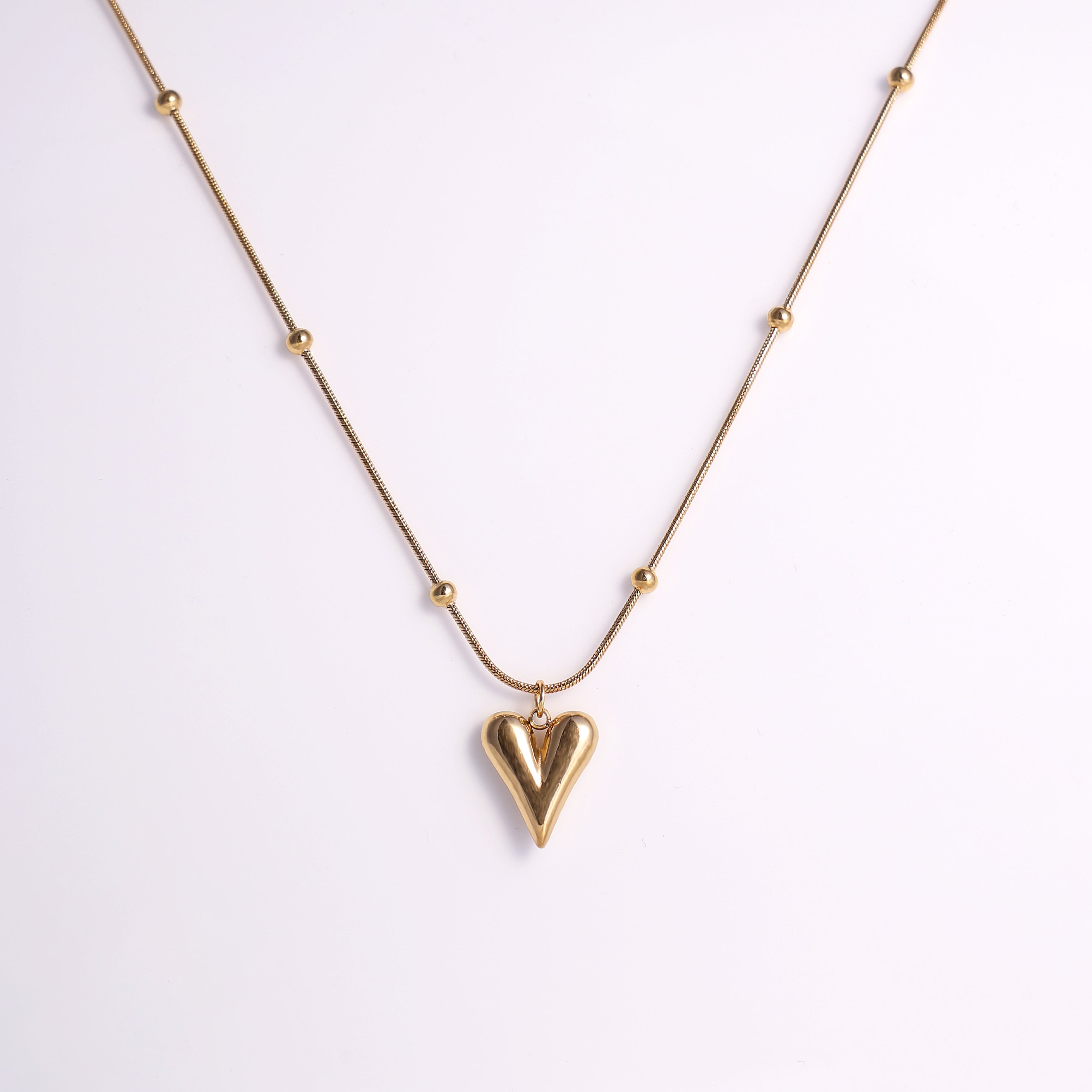 Stylish Gold Heart Necklace with Decorative Beaded